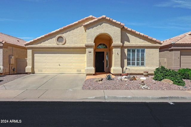 view of front of property with a garage