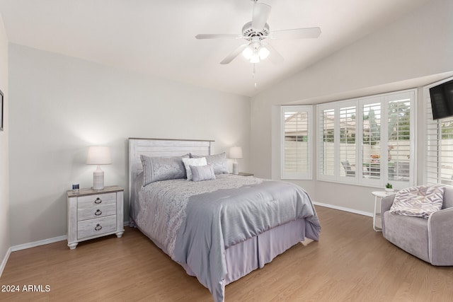 bedroom with hardwood / wood-style floors, multiple windows, and ceiling fan