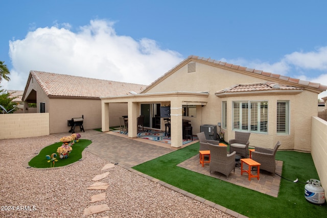 back of house with central AC unit and a patio area