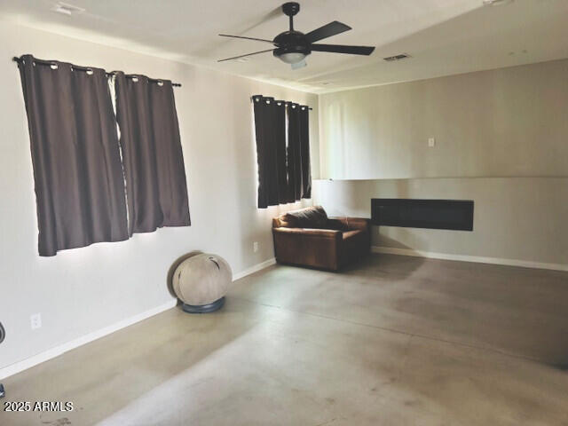 22218 S 208th St, Queen Creek, AZ 85142 - living area with a ceiling fan, finished concrete floors, and baseboards