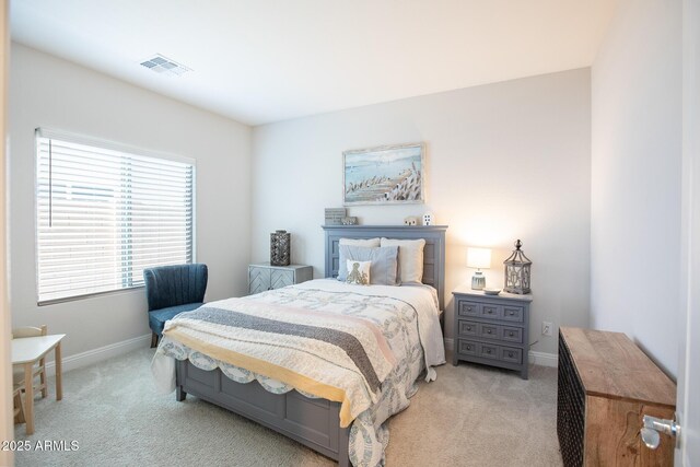 6460 W Springfield Way, Florence, AZ 85132 - bedroom with baseboards, visible vents, and light colored carpet