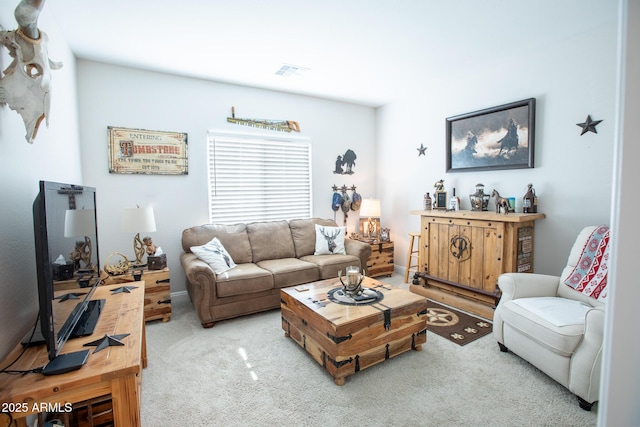 carpeted living area with visible vents