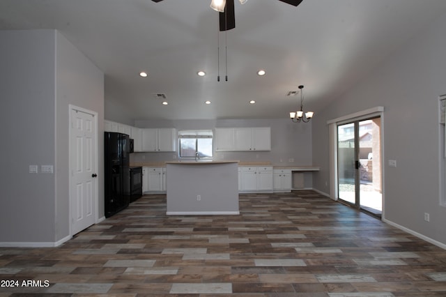 kitchen with ceiling fan with notable chandelier, dark wood-type flooring, white cabinets, a center island, and lofted ceiling