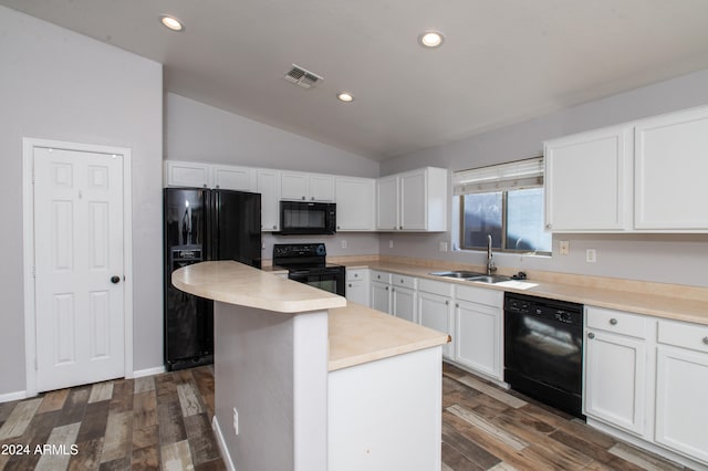 kitchen featuring dark hardwood / wood-style flooring, sink, black appliances, white cabinets, and a center island