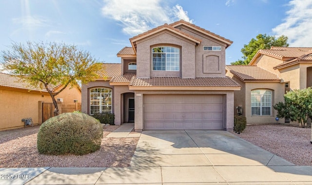 mediterranean / spanish-style house featuring a garage