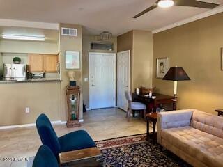 living room featuring ceiling fan and ornamental molding