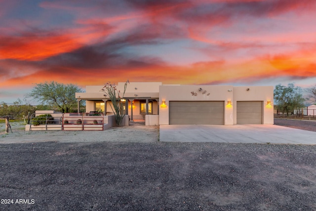 southwest-style home featuring a garage