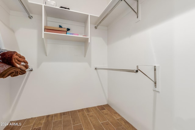 spacious closet featuring hardwood / wood-style floors