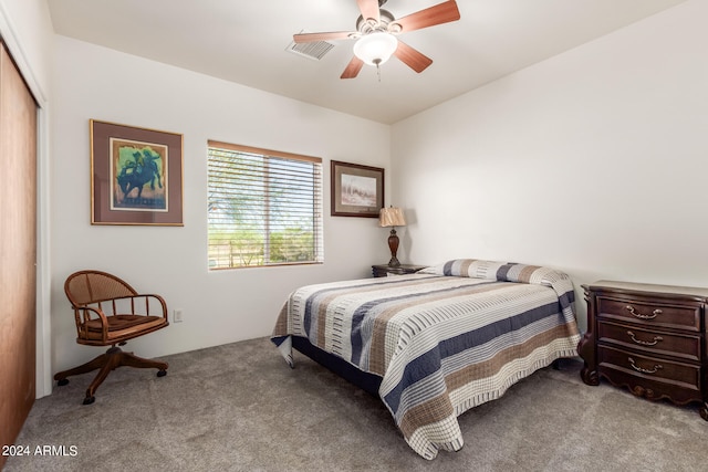 bedroom with a closet, ceiling fan, and carpet floors