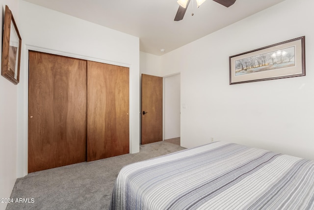 bedroom featuring carpet, ceiling fan, and a closet