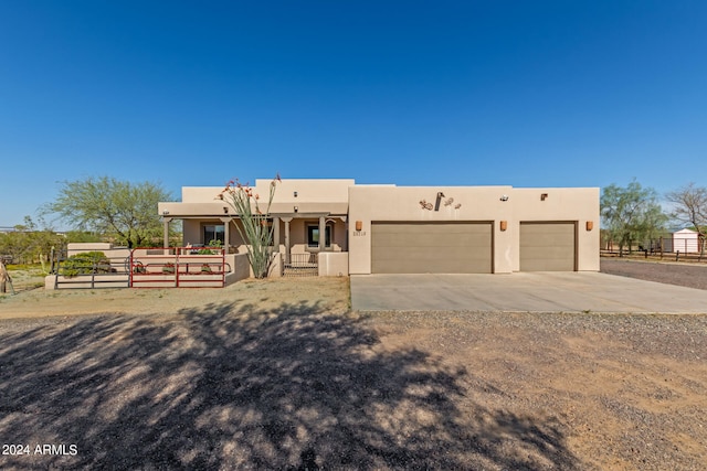 southwest-style home featuring a garage