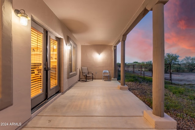 view of patio terrace at dusk