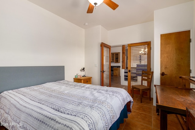 bedroom with dark tile flooring and ceiling fan