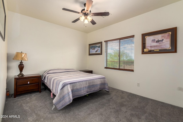 bedroom with ceiling fan and dark carpet