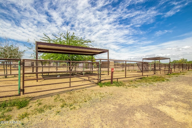 exterior space featuring a rural view and an outdoor structure