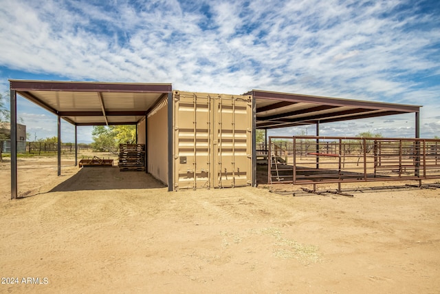 view of horse barn with an outdoor structure