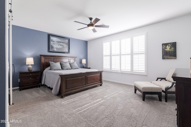 bedroom with ceiling fan and light colored carpet