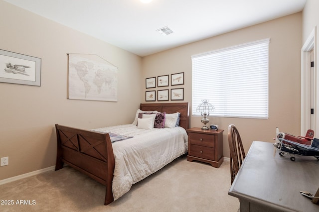 bedroom featuring light colored carpet