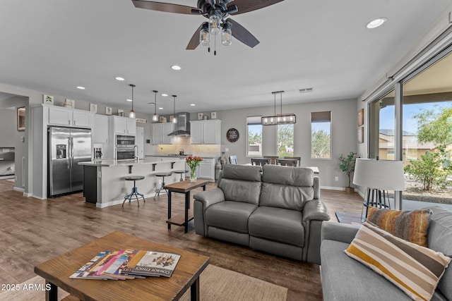 4246 Stage Stop Way, Wickenburg, AZ 85390 - living room featuring a ceiling fan, recessed lighting, dark wood-style floors, and baseboards