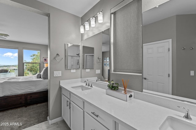 4246 Stage Stop Way, Wickenburg, AZ 85390 - bathroom with connected bathroom, marble finish floors, vanity, and baseboards