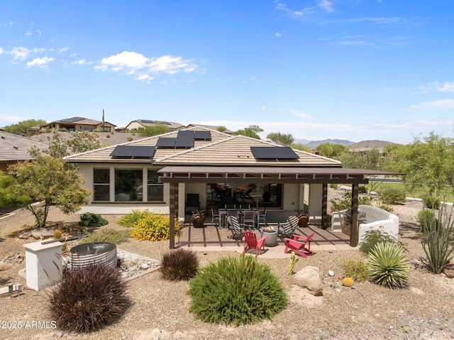 4246 Stage Stop Way, Wickenburg, AZ 85390 - rear view of property with a patio area, solar panels, and a mountain view