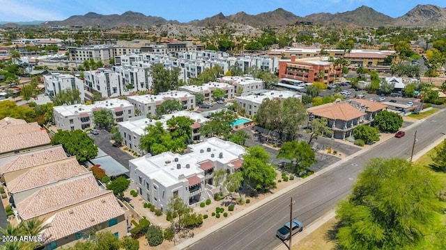 birds eye view of property featuring a mountain view