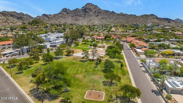 birds eye view of property featuring a mountain view