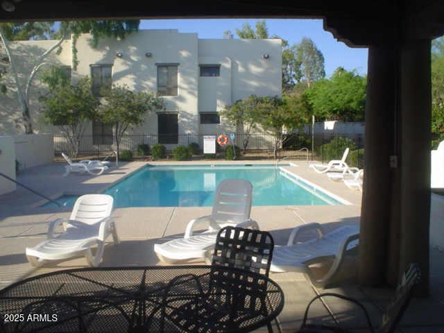 view of swimming pool with a patio