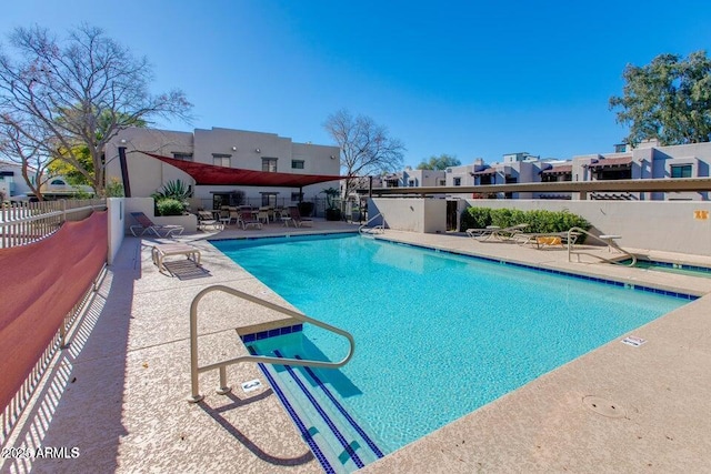 view of swimming pool with a patio area