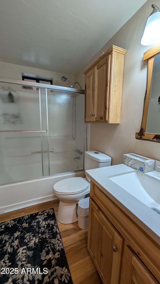 2425 Tall Trees Loop, Forest Lakes, AZ 85931 - bathroom featuring vanity, wood finished floors, and shower / bath combination with glass door