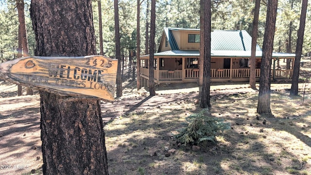 2425 Tall Trees Loop, Forest Lakes, AZ 85931 - rear view of property featuring a porch, a metal roof, and board and batten siding