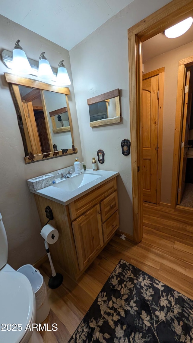 2425 Tall Trees Loop, Forest Lakes, AZ 85931 - bathroom with wood finished floors and vanity