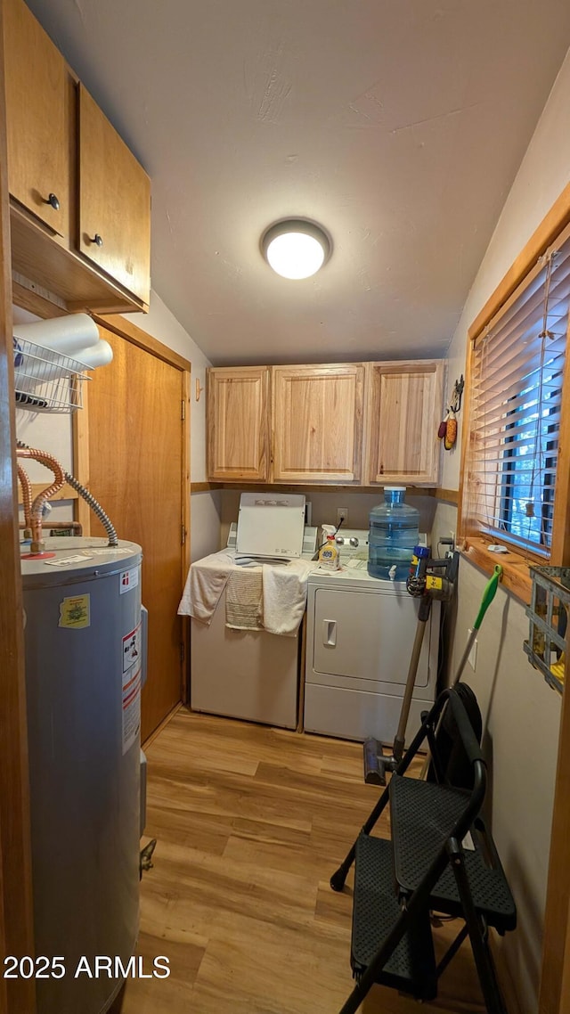 2425 Tall Trees Loop, Forest Lakes, AZ 85931 - laundry area featuring electric water heater, cabinet space, independent washer and dryer, and light wood-style floors