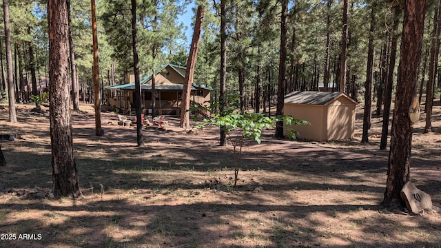 2425 Tall Trees Loop, Forest Lakes, AZ 85931 - view of yard with a shed and a forest view