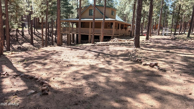 2425 Tall Trees Loop, Forest Lakes, AZ 85931 - rear view of house featuring a porch and a metal roof