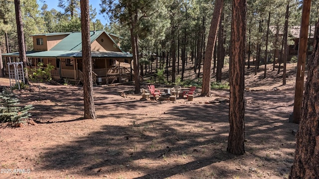 2425 Tall Trees Loop, Forest Lakes, AZ 85931 - view of yard with covered porch and an outdoor fire pit