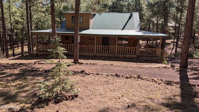 2425 Tall Trees Loop, Forest Lakes, AZ 85931 - view of front of home with a porch, a metal roof, and view of scattered trees