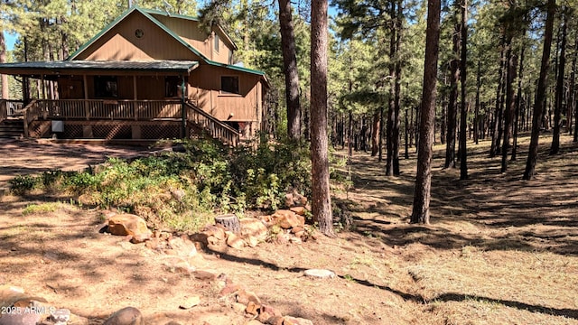 2425 Tall Trees Loop, Forest Lakes, AZ 85931 - back of house with covered porch and stairs