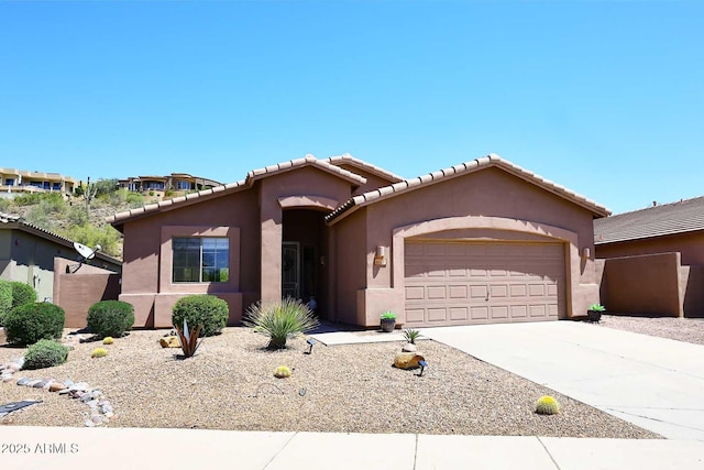 9827 N Desert Rose Dr, Fountain Hills, AZ 85268 - view of front of property featuring an attached garage, stucco siding, concrete driveway, and a tiled roof