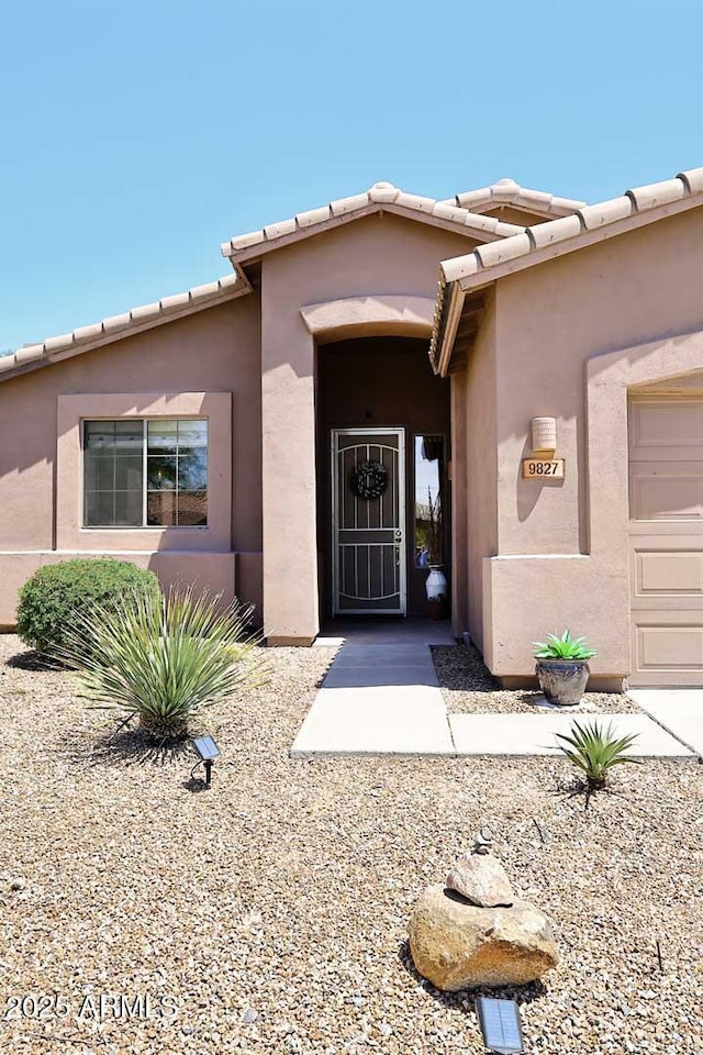 9827 N Desert Rose Dr, Fountain Hills, AZ 85268 - property entrance featuring stucco siding and a tiled roof