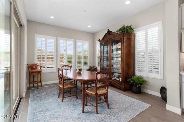 dining area with hardwood / wood-style flooring