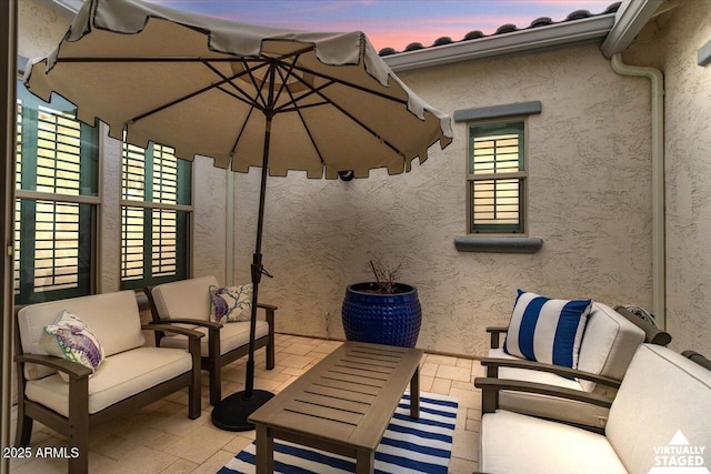 view of patio terrace at dusk