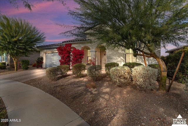 view of front of property with a garage