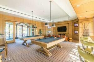 rec room featuring a raised ceiling, french doors, carpet floors, and pool table