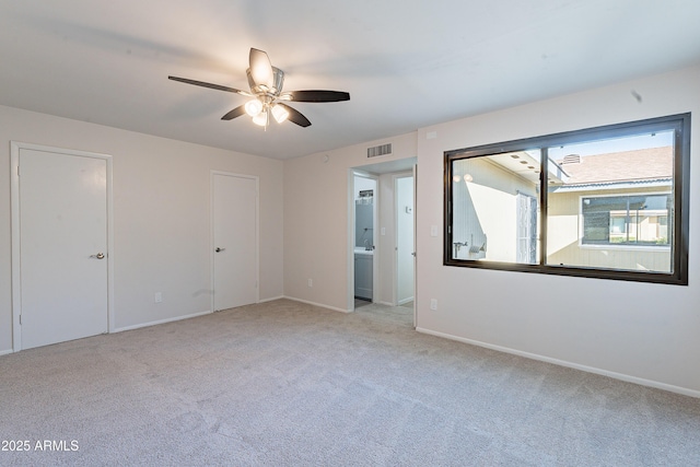 2440 N 22nd Ave, Phoenix, AZ 85009 - unfurnished bedroom with carpet floors, baseboards, and a ceiling fan
