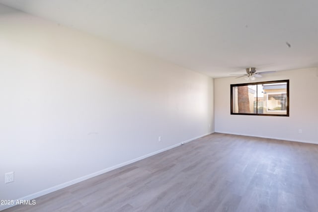 2440 N 22nd Ave, Phoenix, AZ 85009 - unfurnished room featuring wood finished floors, baseboards, and ceiling fan
