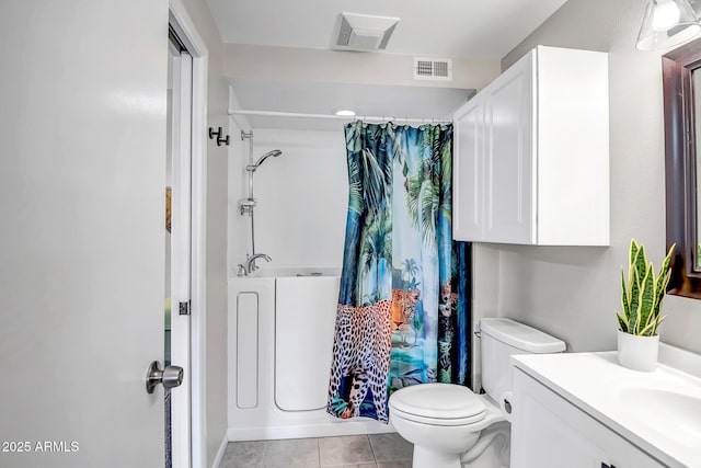 full bathroom with visible vents, toilet, vanity, and tile patterned flooring