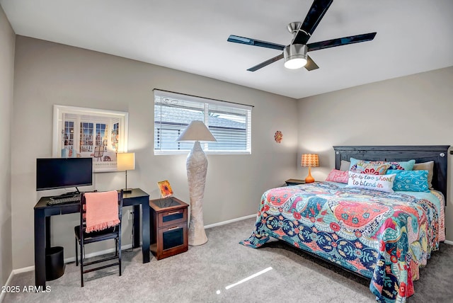 carpeted bedroom featuring ceiling fan and baseboards