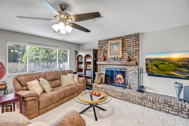 carpeted living area featuring ceiling fan, a fireplace, and visible vents