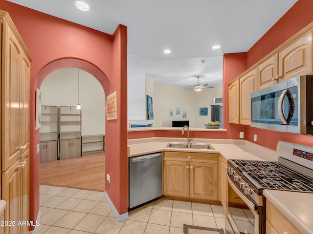 1401 N 4th St Unit 234, Flagstaff, AZ 86004 - kitchen with appliances with stainless steel finishes, light tile patterned flooring, light brown cabinetry, and recessed lighting